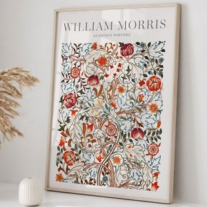 May include: A framed print of a floral pattern with red, orange, and green leaves and flowers. The print is titled "William Morris Acanthus Portiere".