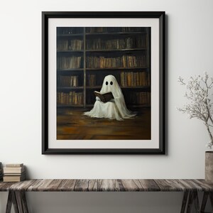 May include: A white ghost figure sits in a library, reading a book. The ghost is wearing a white sheet and has two black eyes. The library is filled with bookshelves and books.