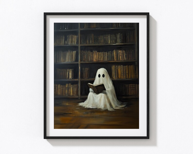May include: A white ghost with two black eyes sits in a library reading a book. The ghost is wearing a white sheet and is sitting in front of a large bookshelf filled with books.