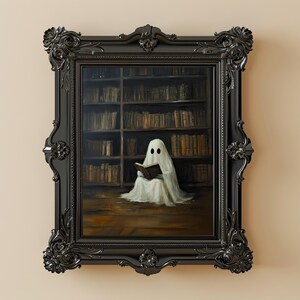 May include: A framed painting of a white ghost reading a book in a library. The ghost is wearing a white sheet and has two black eyes. The library shelves are filled with books.