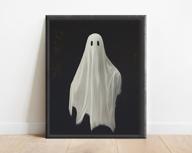 Peut inclure: Un fant&ocirc;me blanc avec deux yeux noirs est repr&eacute;sent&eacute; sur un fond noir. Le fant&ocirc;me flotte dans les airs et a une forme de drap fluide et translucide.