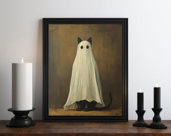 May include: A black cat wearing a white ghost costume with black eyes. The cat is sitting on a brown background in a black frame.
