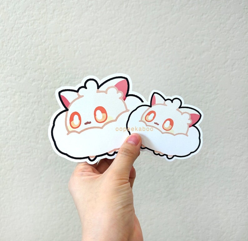 May include: Two white cloud-shaped stickers with cartoon fox faces. The larger sticker has the text "oopeekaboo" printed on it.