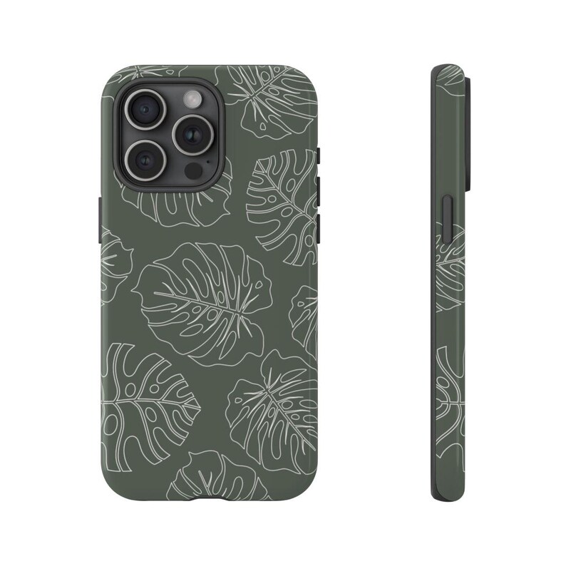 May include: A green phone case with a white leaf pattern. The case has a cutout for the camera lens.