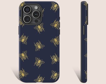 May include: A navy blue phone case with a gold bee pattern. The case has a cutout for the camera lens.