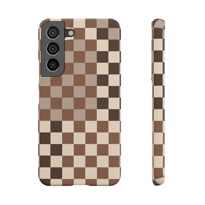 May include: A brown and beige checkered phone case with a triple camera lens cutout.