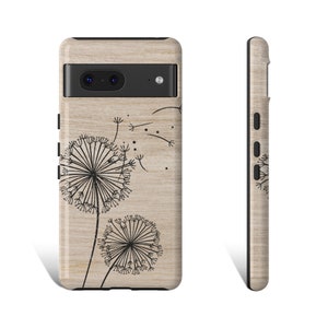 May include: A wood-grain phone case with a black outline and a design of two dandelions with seeds blowing in the wind.