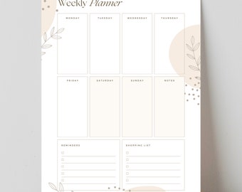 Op de afbeelding: Een weekplanner met een beige en bruine kleurstelling. De planner heeft secties voor elke dag van de week, herinneringen en een boodschappenlijstje. De planner is versierd met eenvoudige bloemenillustraties en stippen.