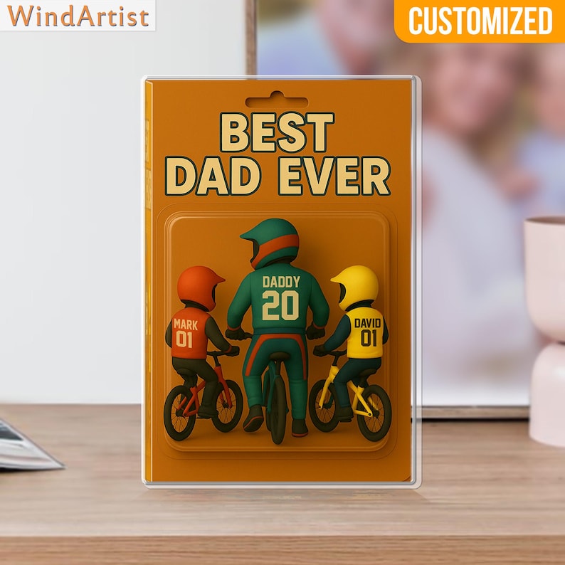 May include: A framed artwork with the text "BEST DAD EVER" and a graphic of a father and two children on bicycles. The father wears a green helmet and jersey with the number 20. The children wear orange and yellow helmets. The word "CUSTOMIZED" is at the top.