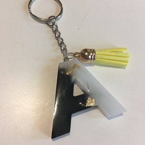 Resin black, white and gold leaf keyring with tassel
