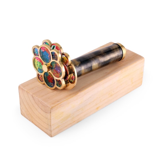 A handcrafted brass kaleidoscope with 411 favorites and serious steampunk desk-trophy energy — the kind of object people pick up and never want to put down.