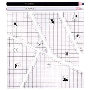 May include: A clear quilting template with a grid pattern and angled cutouts, accompanied by a black and a white pencil. The pencils have the word "STANDARD" printed on them. The template is designed for patchwork and quilting projects.