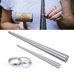 May include: Two silver metal ring mandrels, one long and one short, used for sizing and shaping rings. The mandrels are made of polished metal and have a smooth, rounded surface.