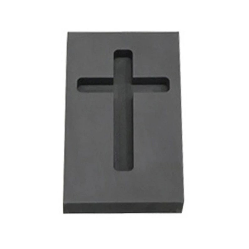 Puede incluir: Un molde de silicona negro con forma de cruz. El molde est&aacute; dise&ntilde;ado para crear un objeto con forma de cruz.