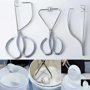 May include: Three stainless steel tongs for handling hot objects. The tongs have different designs and are used for tasks like lifting plates or stirring liquids.