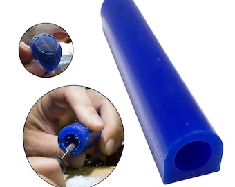 May include: A blue wax carving stick with a hollow center. The stick is used for creating jewelry designs.
