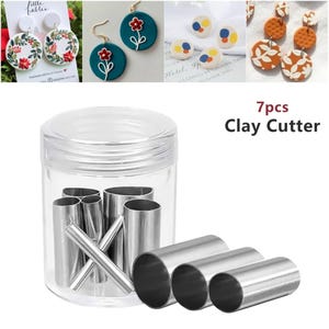 May include: A set of seven stainless steel clay cutters in a clear plastic container. The cutters are various shapes and sizes, including circles, ovals, and rectangles. The container has a lid and is labeled "7pcs Clay Cutter".