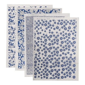 May include: Four sheets of blue and white patterned paper. The patterns include a floral design, a geometric design, a wavy line design, and a scattered dot design.