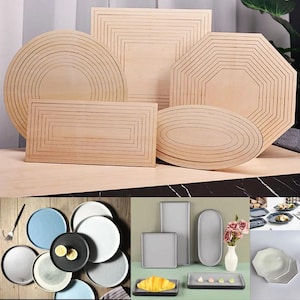 May include: Assortment of wooden trays in various shapes and sizes, including round, oval, square, and octagonal. The trays are made of light wood with a natural finish and have a decorative pattern of concentric circles or lines.