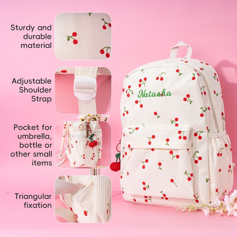May include: White canvas backpack with a cherry print and the name "Natasha" embroidered on the front. The backpack has adjustable shoulder straps, a pocket for an umbrella or bottle, and a triangular fixation.