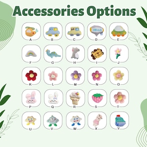 May include: A grid of twenty-five small plush accessories labelled A through Y, featuring various shapes including vehicles, animals, flowers, and food items in diverse colours like yellow, blue, pink, red, and green, with the text Accessories Options.