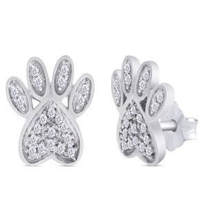 May include: A pair of silver paw print earrings with small clear cubic zirconia stones.
