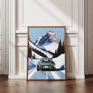 May include: A vintage green Porsche 911 driving on a snowy mountain road. The car is facing away from the viewer and the mountain peak is in the background.