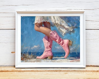 May include: A painting of a woman's legs wearing pink cowboy boots. The woman is wearing a white dress and is standing on a beach with blue water in the background.