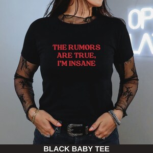 May include: Black baby tee with the text "THE RUMORS ARE TRUE, I'M INSANE" in red.