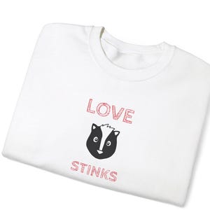 Love Stinks, anti valentine, skunk, funny valentine, skunk, galentine, gift for singles, single in valentines - Unisex Crewneck Sweatshirt