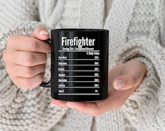 May include: Black coffee mug with white text that reads "Firefighter" and a nutrition facts label listing the percentage daily value of hard work, dedication, passion, respect, knowledge, caffeine, and regret.
