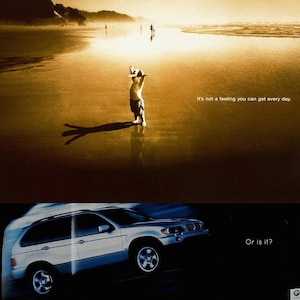 May include: A silver SUV drives on a beach with a child standing in the sand in the background. The text "It's not a feeling you can get every day. Or is it?" is displayed on the image.