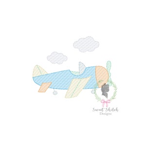 May include: A blue and orange airplane with yellow wings flying through the clouds. The airplane has a propeller and a small window. The clouds are white and fluffy.