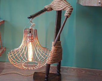 Handmade and very unique lantern carrying indigenous figure floor or table display lamp