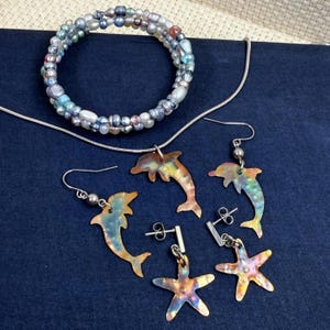 Flame Painted Copper Dolphin Starfish Jewelry Set: Necklace, Two Earring Sets & Bracelet; Stainless Steel