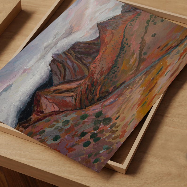 May include: A painting of a mountain range with a cloudy sky. The mountains are painted in shades of brown, red, and orange, with hints of green. The sky is a soft blue with white clouds.