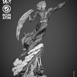 May include: A grayscale 3D printed model of a superhero figure standing on a rocky base. The figure is wearing a cape and has a dramatic pose with one arm raised. The base features a stylized flame design and the text "Wicked".