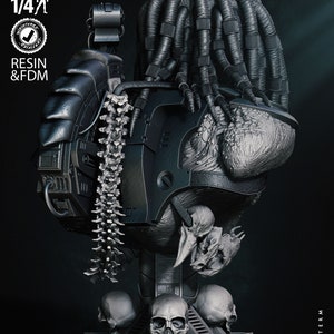 May include: A detailed, black and gray 3D printed bust of a Predator character with dreadlocks, holding a skull in its hand. The bust is mounted on a base with three skulls. The image includes the text "Wicked" and "Next Term".