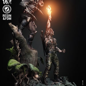 May include: A 3D printed model of a Predator from the movie Predator, holding a spear, facing a human character holding a torch. The model is printed in resin and FDM, and is 1/6 scale. The model is set on a base with a tree and foliage.