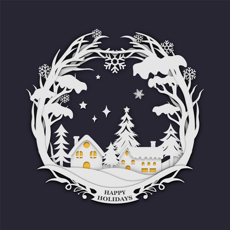 May include: White paper cut-out design of a winter scene with snow-covered houses, trees, and a snowy landscape. The design is in a circle with the words "Happy Holidays" at the bottom.
