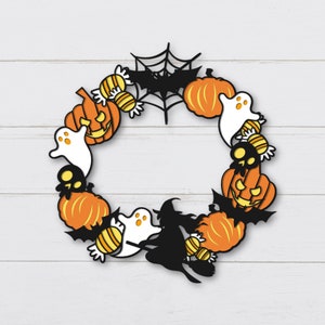 May include: A Halloween wreath with orange pumpkins, black bats, white ghosts, and candy corn. The wreath is decorated with a black spider web.