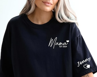 May include: Black oversized t-shirt with the text "Mama Est 2024" on the front and "Jenny" with two hearts on the sleeve.