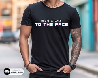 May include: Black t-shirt with the text "Drum & Bass To The Face" in a glitched font.