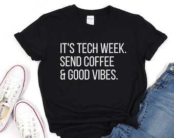 May include: Black t-shirt with white text that reads "It's Tech Week. Send Coffee & Good Vibes."