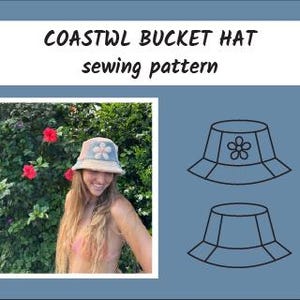 May include: A bucket hat sewing pattern with the text "COASTWL BUCKET HAT sewing pattern." The image shows a woman wearing a light blue and beige bucket hat with a flower design. The hat is set against a background of green foliage and red flowers.