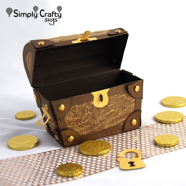 May include: A brown paper treasure chest with gold accents and a gold lock. The chest is open and there are gold coins scattered around it.