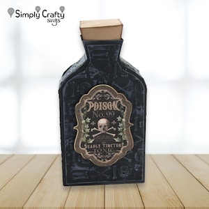 May include: A black papercraft bottle with a tan cork stopper, featuring a repeating pattern of skulls and bones. A central ornate label displays the text Poison No. 99, Deadly Tincture, and Toxic, accompanied by a skull and crossbones graphic.