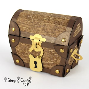 May include: A brown paper treasure chest with gold accents, a gold lock and key, and metal studs. The chest is closed and has a hinged lid.