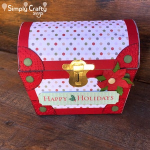 May include: Red and white polka dot Christmas gift box with a gold clasp and a red poinsettia flower. The box has a green and white label that says "Happy Holidays".