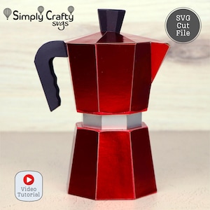 May include: A red geometric coffee maker design with a black handle and top. The image includes the text "Simply Crafty SVGs" and "SVG Cut File". A video tutorial icon is also present.